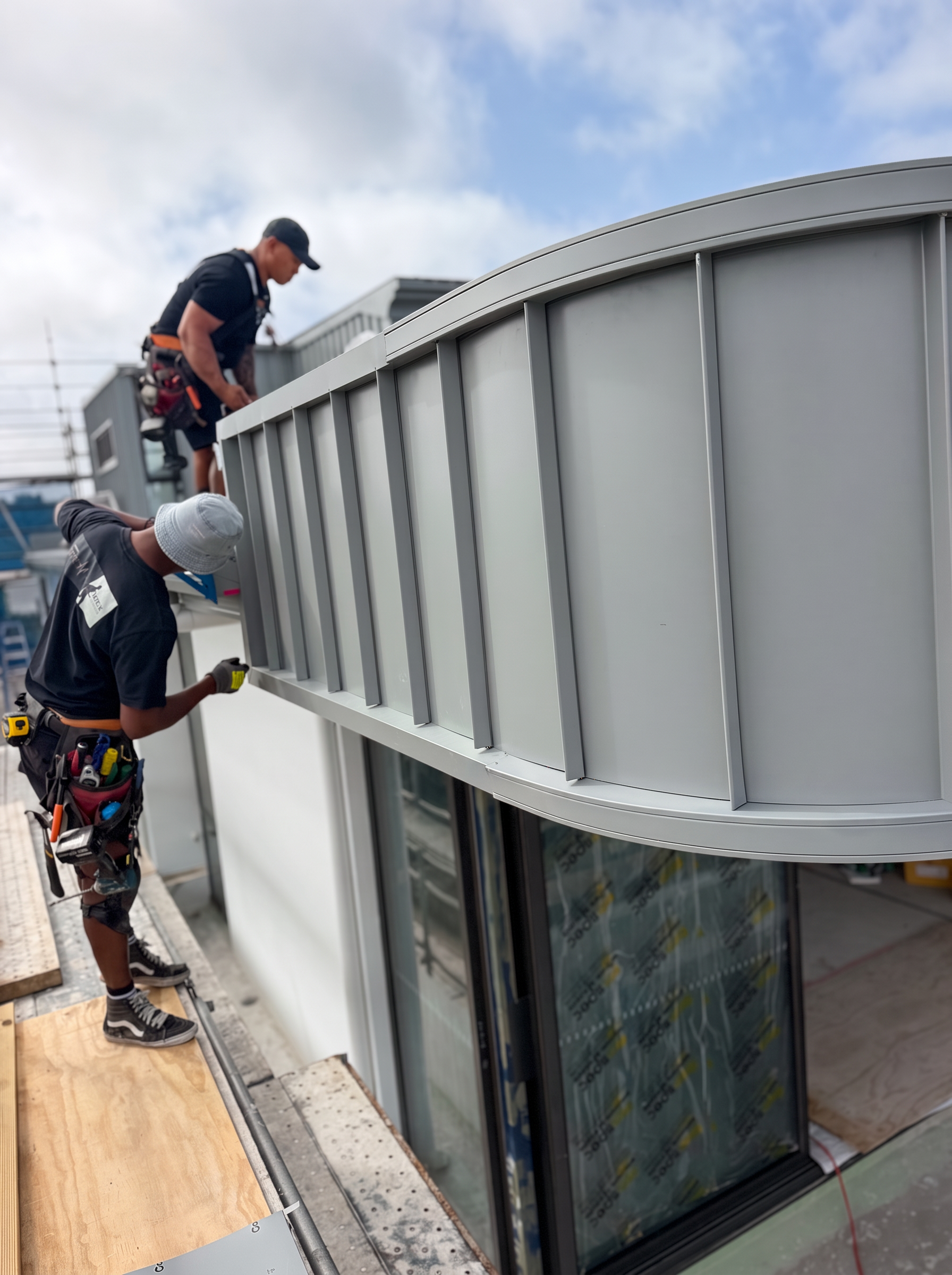 ONTRA installers completing curved standing seam cladding